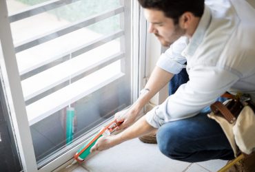 closeup-young-handyman-applying-some-sealant-door-with-sealing-gun (1)
